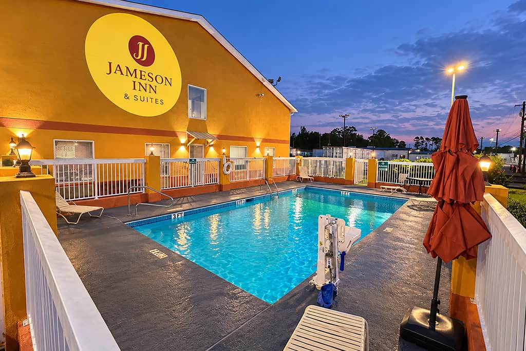 Evening view of the hotel’s outdoor swimming pool.